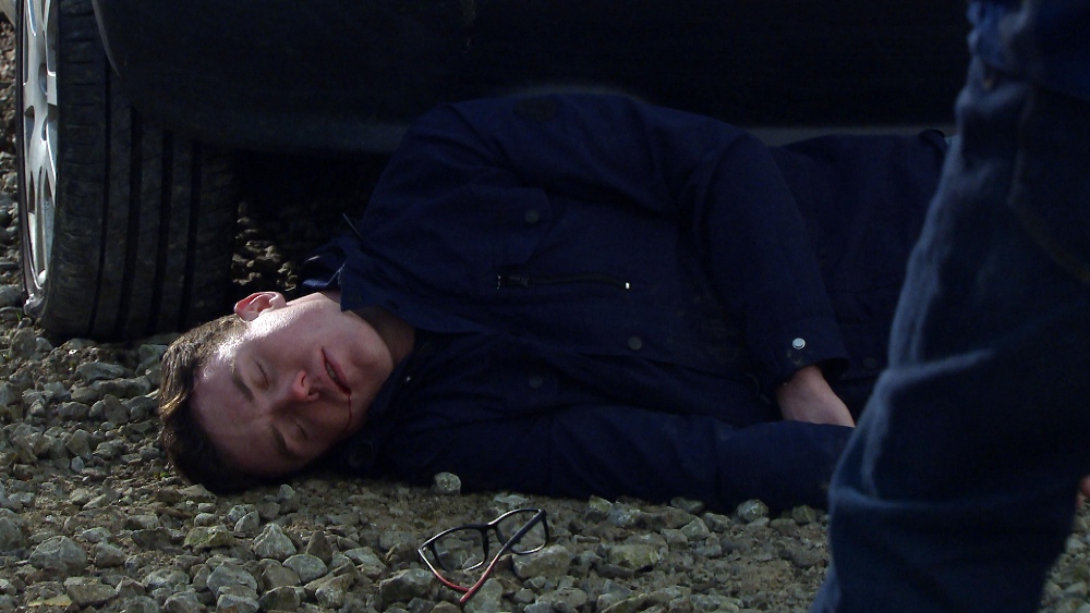 Vinny lies unconscious after being beaten up once more by Paul / Picture Credit: ITV