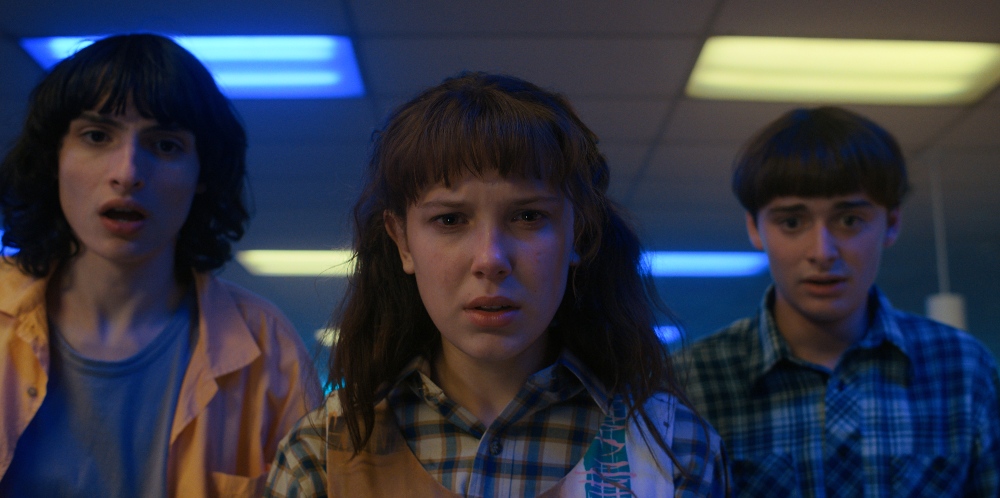 Exactly what Mike, Eleven and Will are looking at here hasn't been revealed, but judging by the looks on their faces, they're a little confused by what's in front of them. / Picture Credit: Netflix