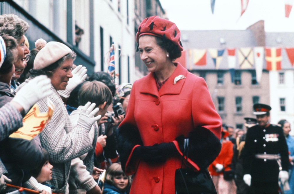 Queen Elizabeth II greets crowds on her Royal Jubilee Tour, May 1977. She beams from ear to ear whilst talking to her public, who look on as adoringly as ever. / Picture Credit: Trinity Mirror/mirrorpix/Alamy Stock Photo