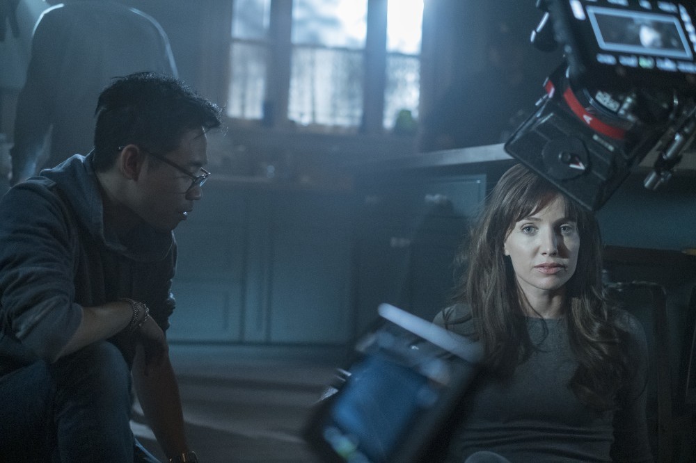 James Wan and Annabelle Wallis on the set of Malignant / Picture Credit: Warner Bros.
