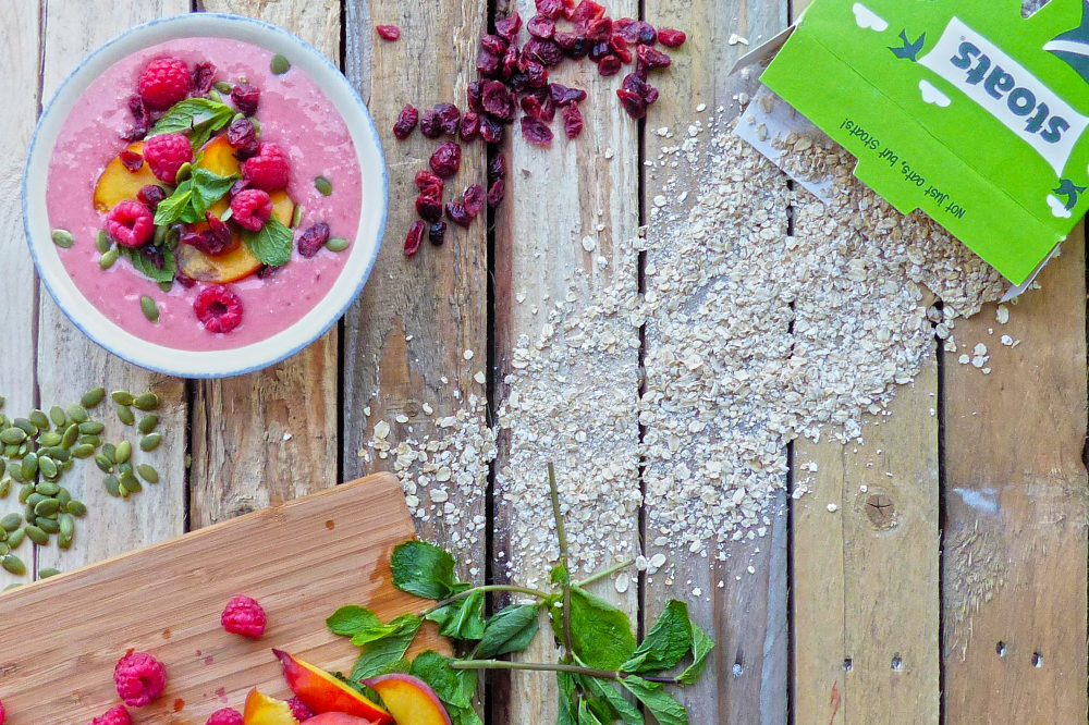 Oaty peach and raspberry smoothie bowl