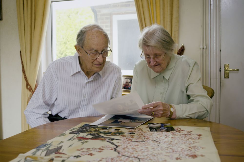 Mr and Mrs Annis looking at photos of Sue / Picture Credit: A & E Networks