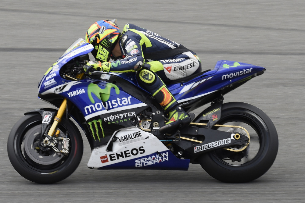Valentino Rossi Testing The M1 Motorcycle's Engine within the Frame of the Current Motorcycle.