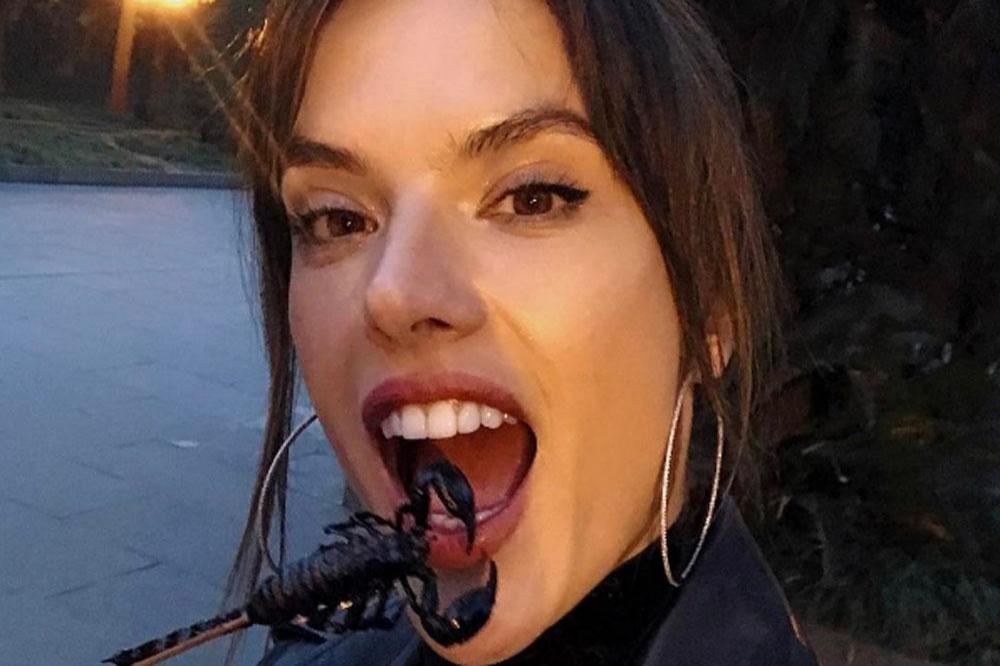 Alessandra Ambrosio eating scorpion (c) Instagram