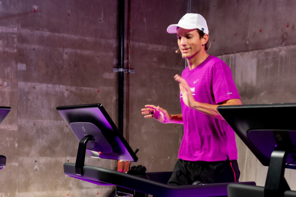 Ashton Kutcher dons purple gym gear as he trains for a marathon