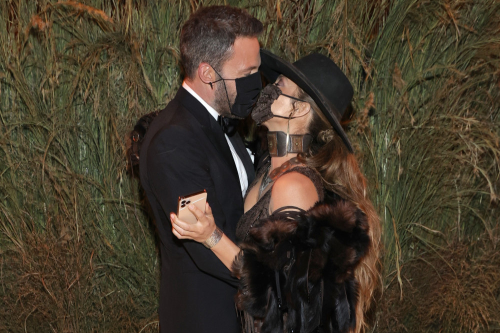 Ben Affleck and Jennifer Lopez kiss at the Met Gala