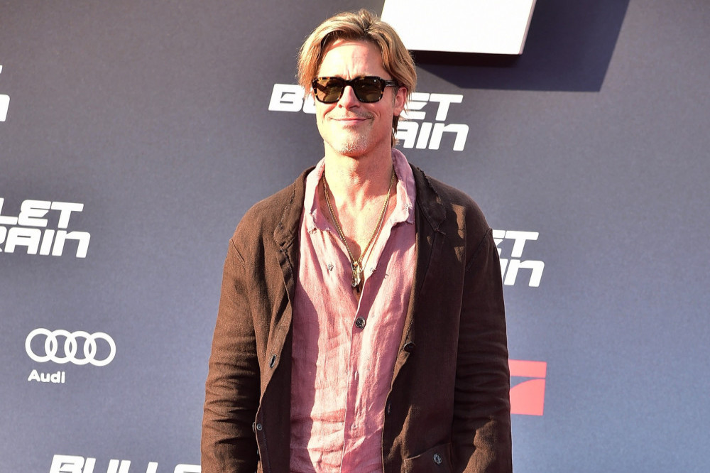 Brad Pitt is said to be getting lessons in Formula 1 and race driving from Lewis Hamilton