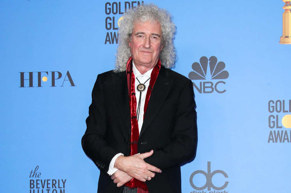 Brian May was offered a cup of tea by his wife when she mistook his heart attack for exercising too hard