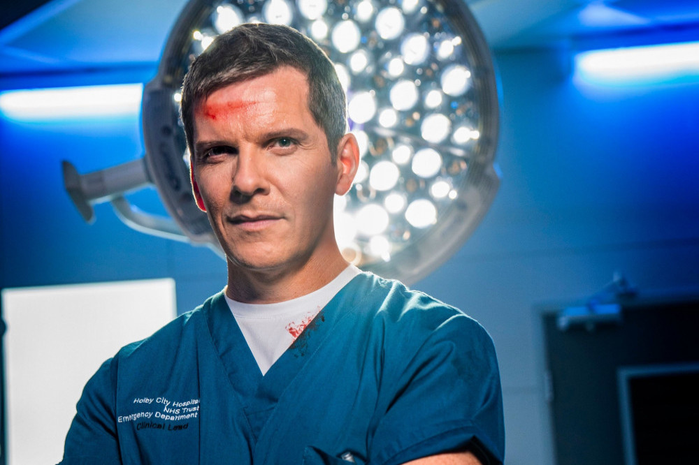 Casualty is to air a football grooming storyline, but Nigel Harman's character will step in to help