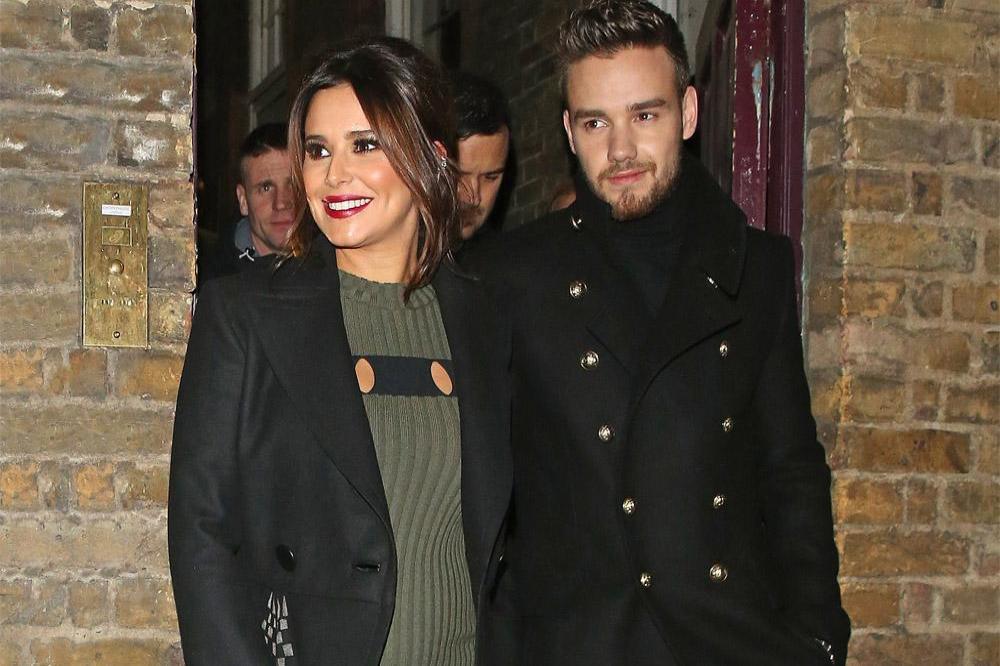 Cheryl showing off baby bump with Liam