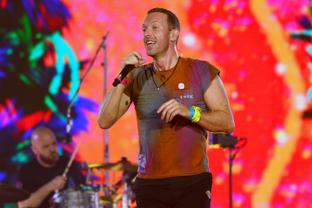 Chris Martin helps serve coffee at Crisis' Finsbury Park branch
