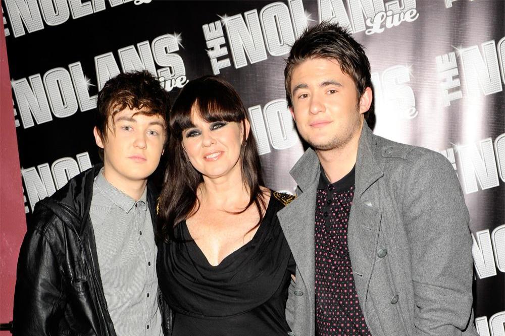 Coleen Nolan with sons Jake (left) and Shane (right)