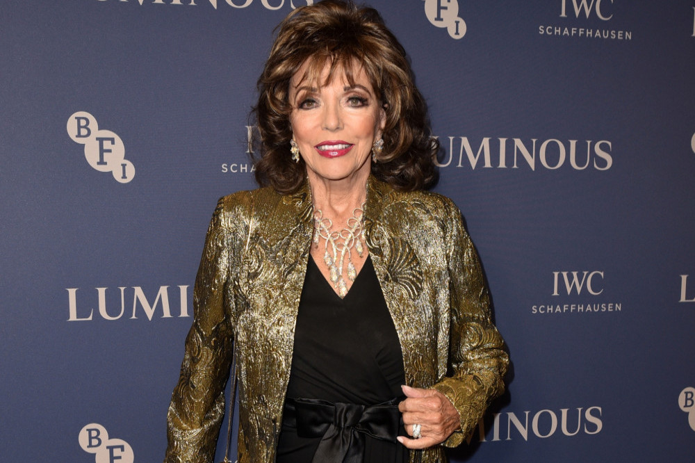Dame Joan Collins suffered a trapped nerve