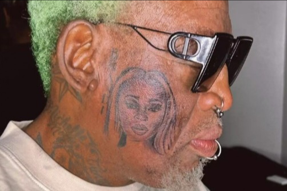 Dennis Rodman gets a tattoo of his wife's face