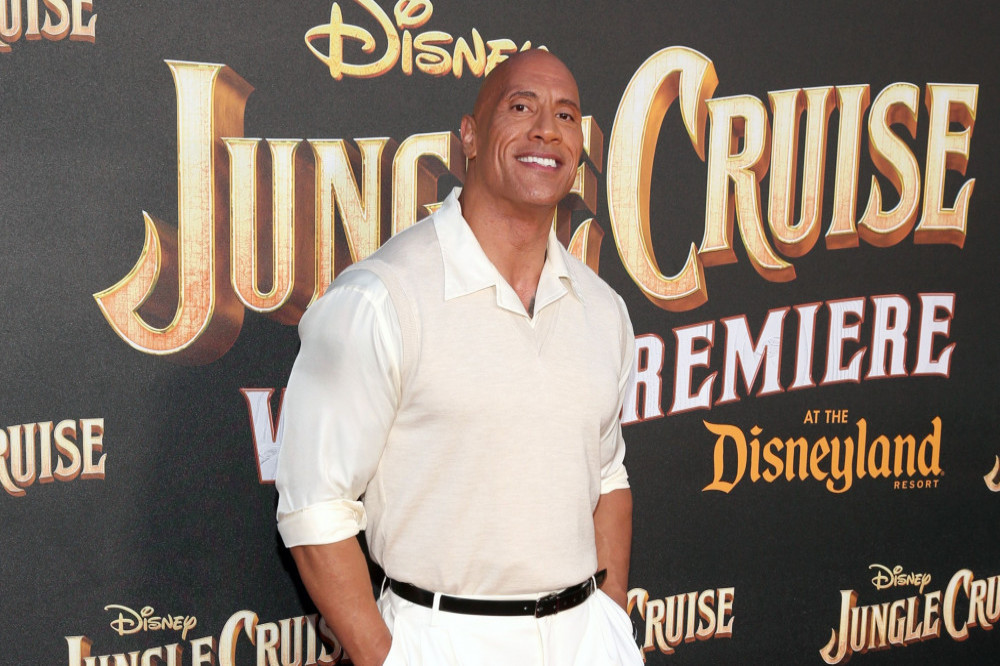 Dwayne 'The Rock' Johnson surprised a young fan battling cancer by working as her waiter
