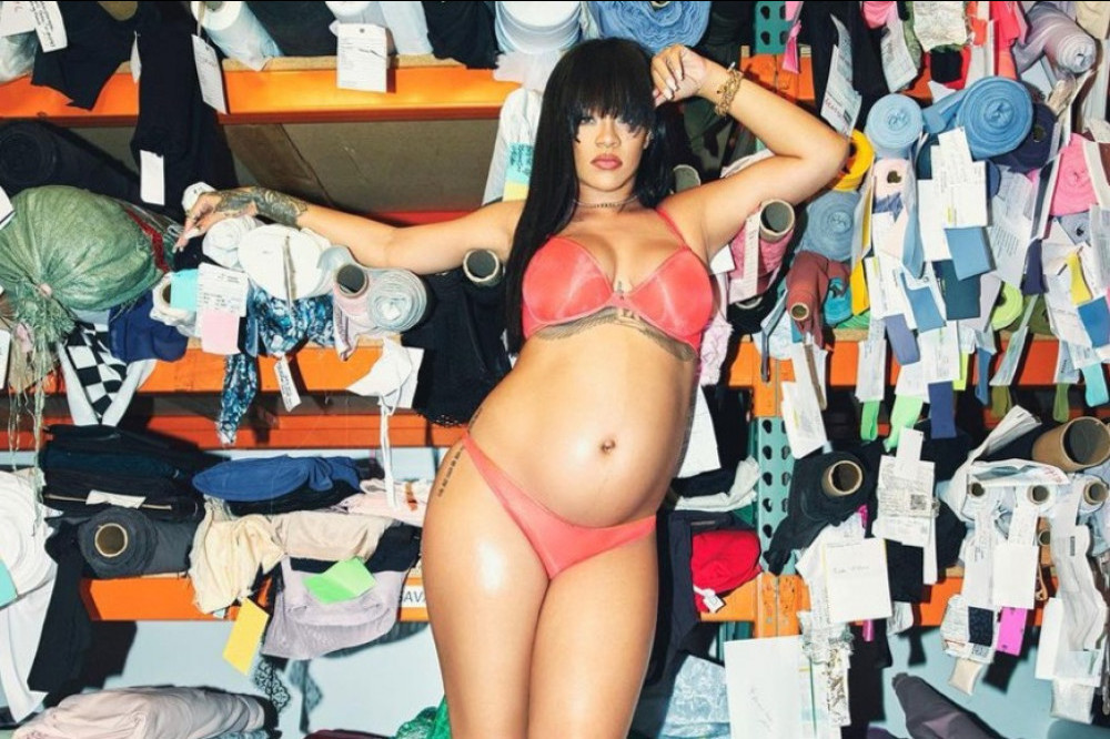 Heavily pregnant Rihanna has showed off her huge baby bump in another steamy snap as she waits for the new arrival