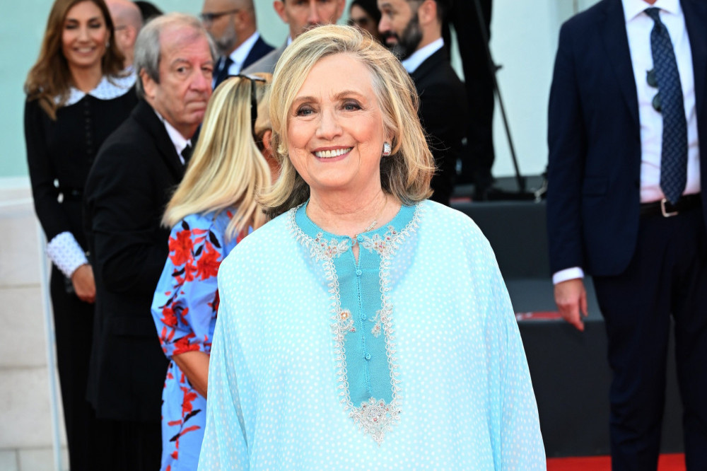 Hillary Clinton wears trouser suits after featuring in a lingerie ad