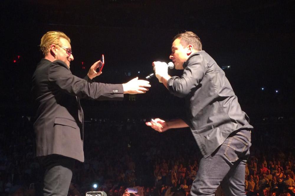 Jimmy Fallon on stage with Bono