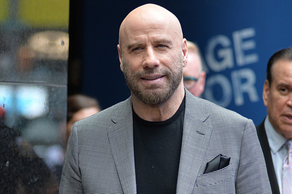 John Travolta has paid tribute to his former co-star Tom Sizemore