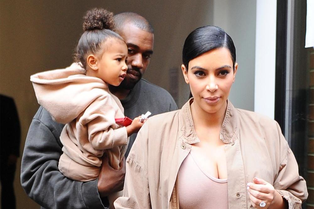 Kim Kardashian West and Kanye West with daughter North