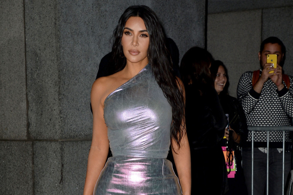 Kim Kardashian is trying to keep everyone comfortable amid her new relationship