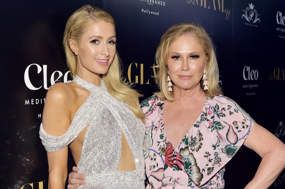 Kathy Hilton has been teaching Paris Hilton how to deal with the early stages of motherhood