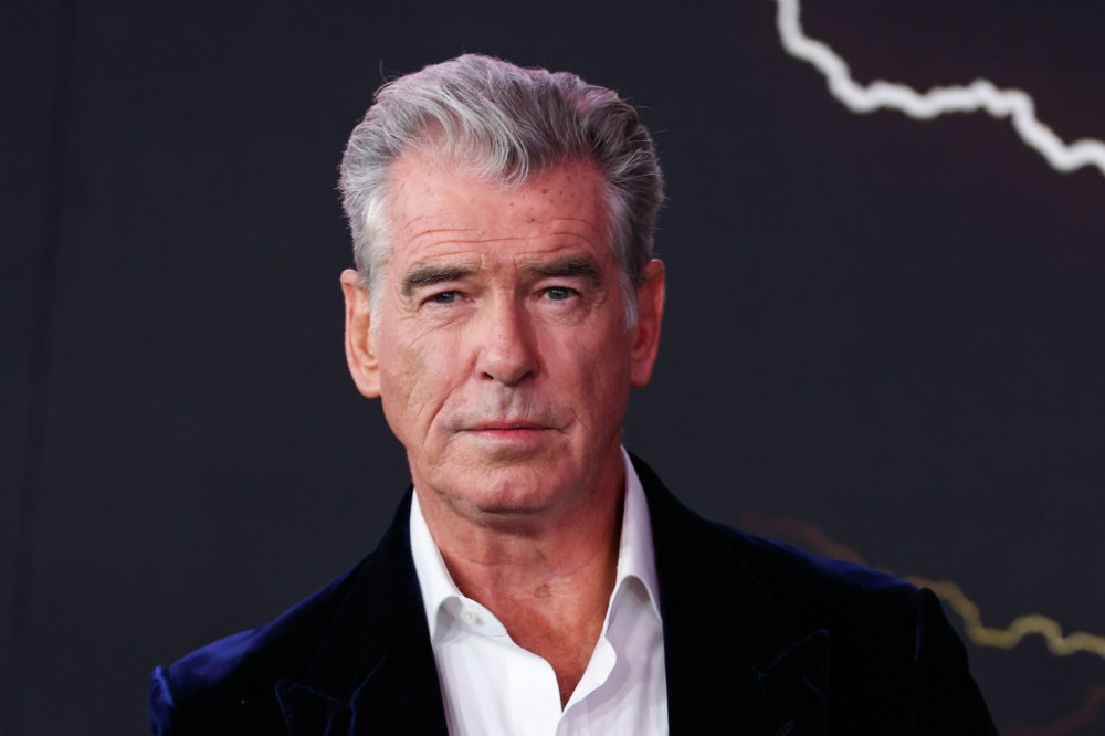 Pierce Brosnan has introduced his new grandchild to the world