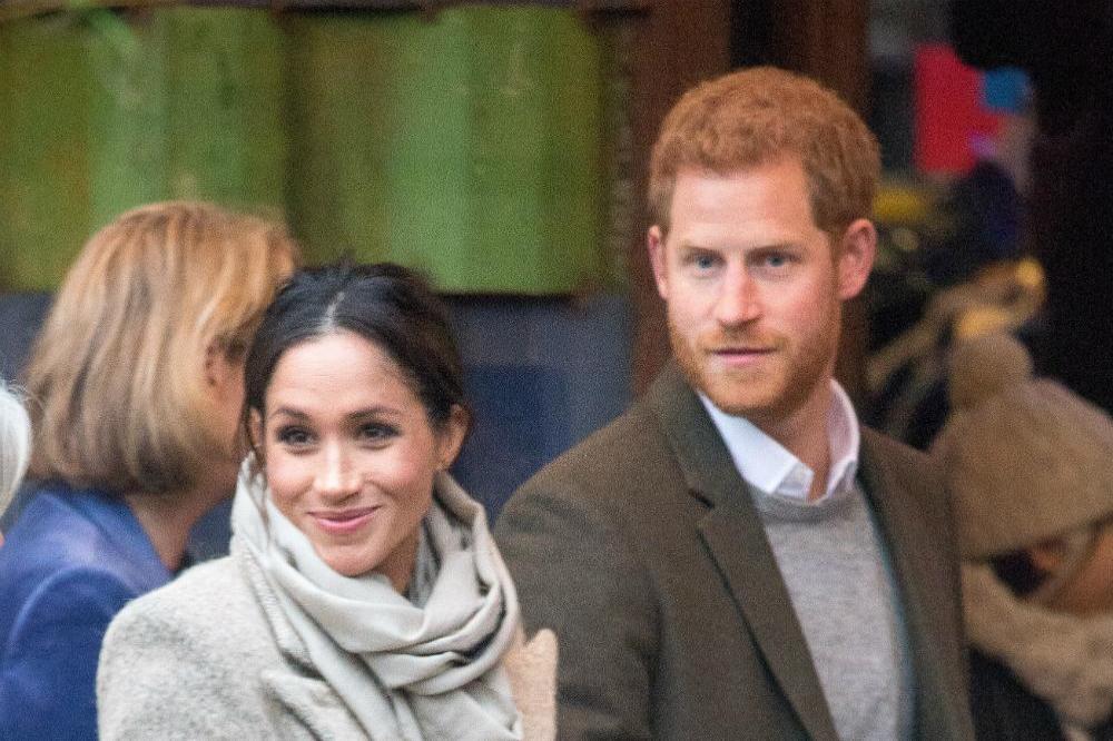 Prince Harry and Meghan Markle in Brixton (c) Zak Hussein