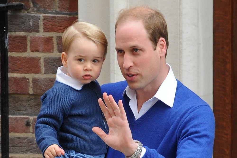 Britain's Prince George with the Duke of Cambridge