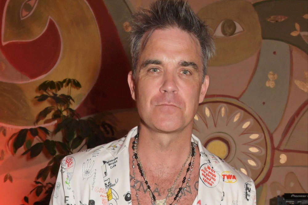 Robbie Williams struggled to balance fame with mental health