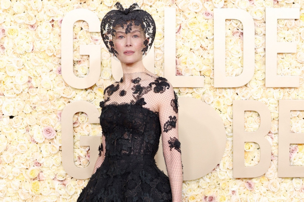Rosamund Pike wore a veil to cover injuries from a skiing accident