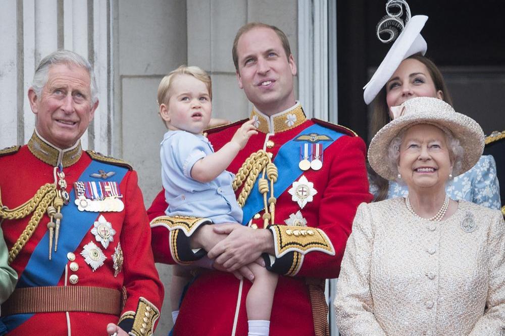 Prince William holding his son Prince George, with Queen Elizabeth