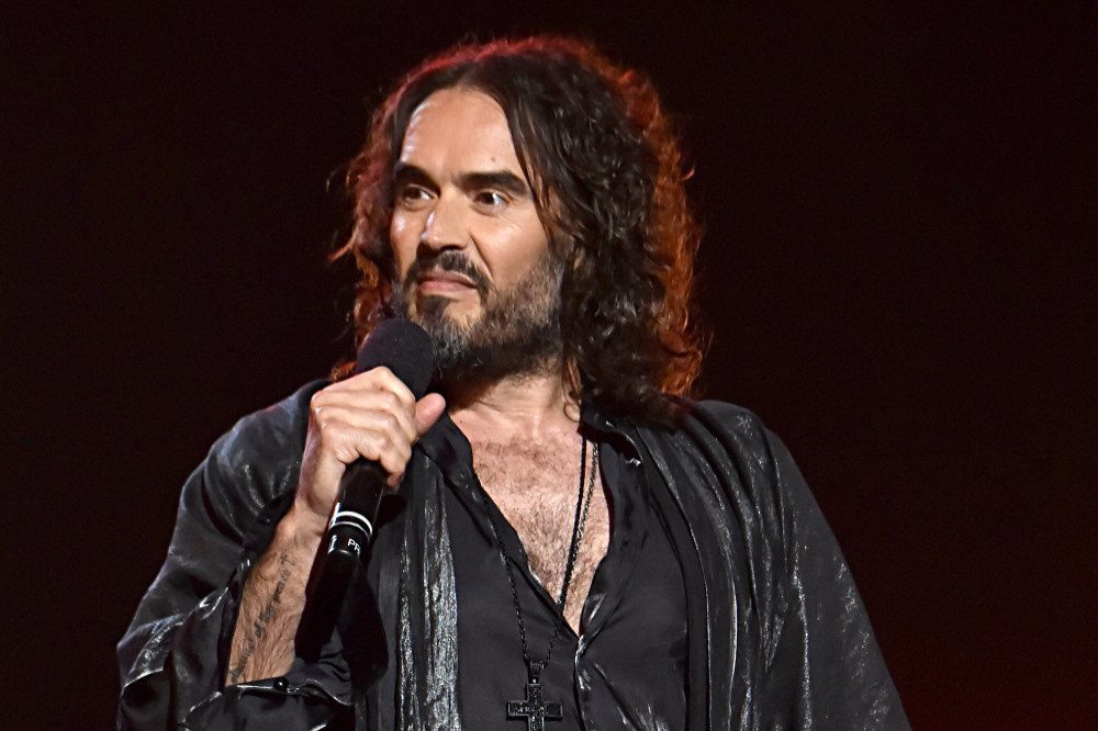 Russell Brand allegedly raped a woman against a wall at his LA mansion after bounding out of a room naked