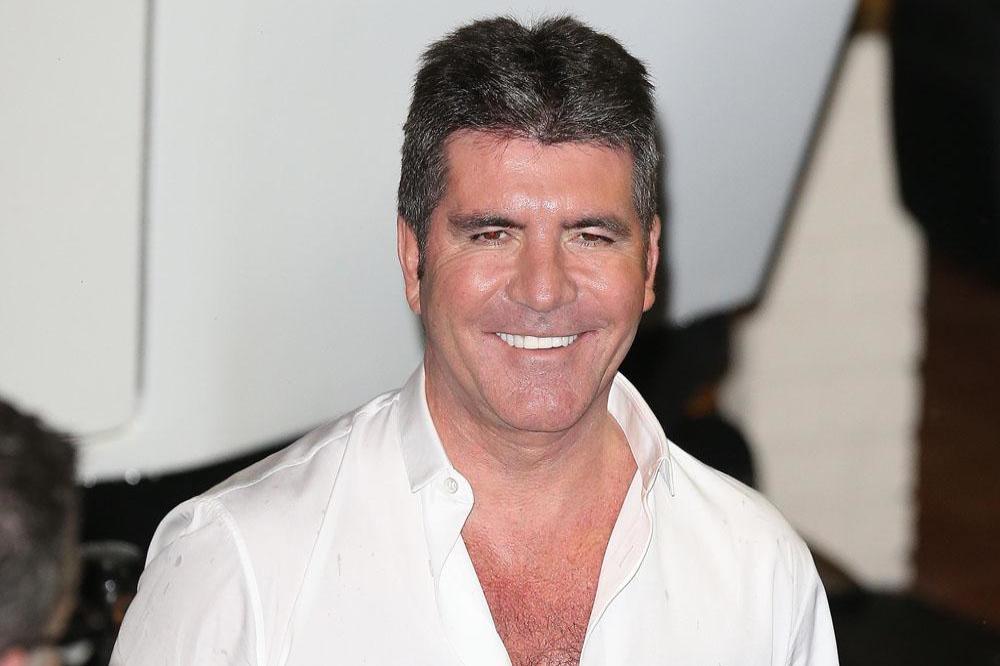 Simon Cowell impressed with the attitude of One Direction following the departure of Zayn Malik.