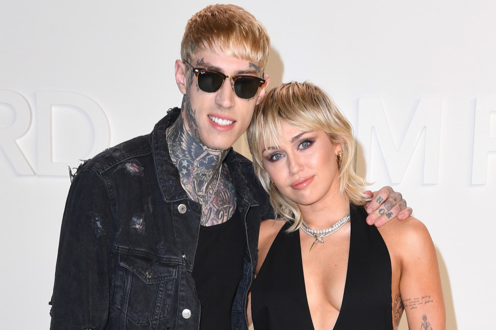 Trace Cyrus with sister Miley