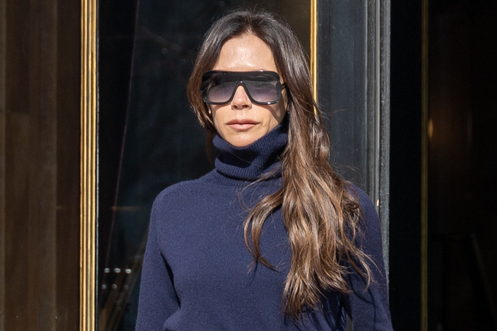 Victoria Beckham says she looks grumpy in pictures because she feels nervous and insecure