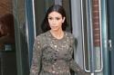 Kim Kardashian flaunts her figure in a lace dress