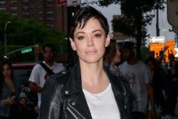 Rose McGowan hands herself in to police