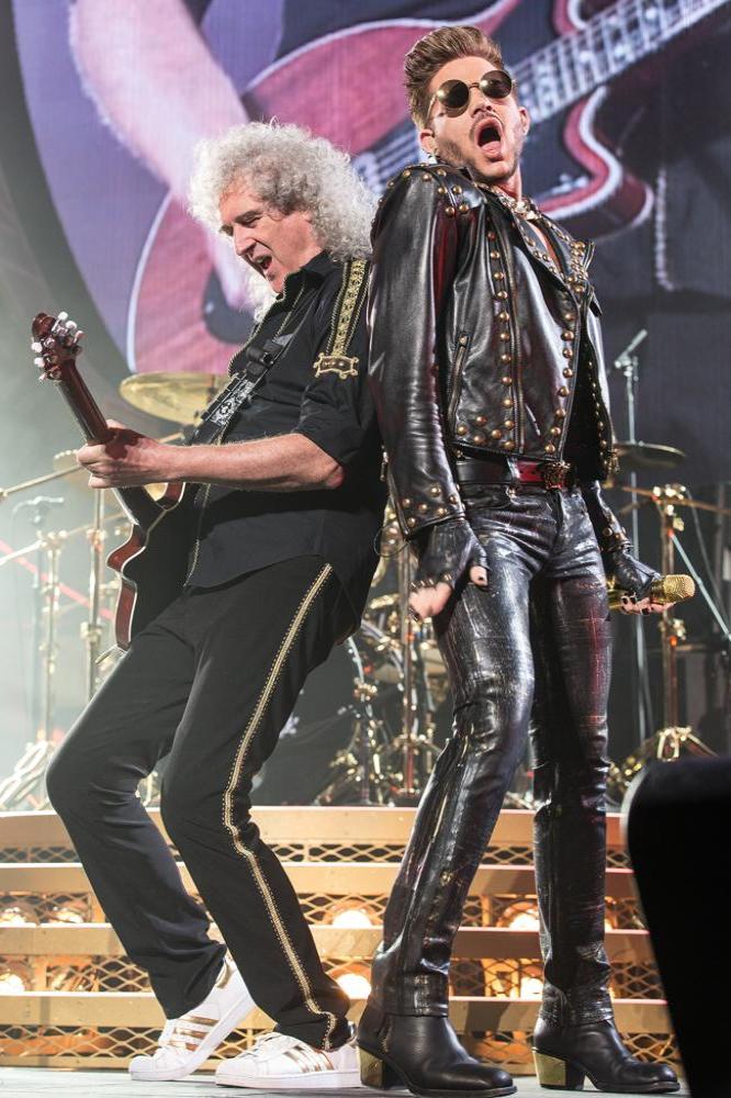 Adam Lambert and Brian May on stage