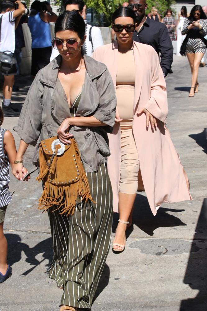 Kim Kardashian West (right) and Kourtney Kardashian