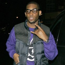Tinie Tempah wearing a quilted gilet