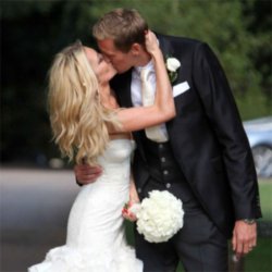 Abbey Clancy and Peter Crouch kiss on their wedding day