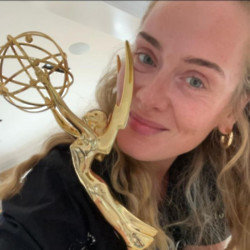 Adele quipped she 'officially has an EGO' as she reacted to her Emmy win