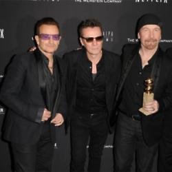 Larry Mullen Jr. with U2 bandmates Bono and The Edge