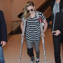 Chloe Grace Moretz braved wearing a pair of high heels to the People Magazine Awards despite having a sprained knee and walking with crutches earlier 