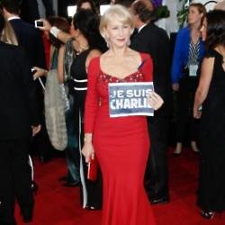 Dame Helen Mirren shows a 'Je Suis Charlie' signage at the Golden Globes