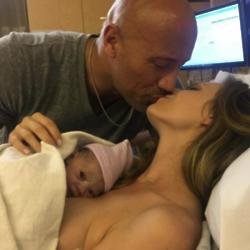 Dwayne Johnson, Lauren Hashian, and their baby daughter, via Instagram (c)