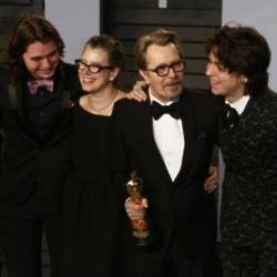 Gary Oldman with his sons and wife Gisele
