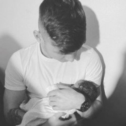 Jack Keating shared a picture of himself holding his new baby daughter