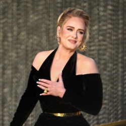 Adele has joked her boyfriend was ‘livid’ after a fan apparently tried to woo her with his phone number